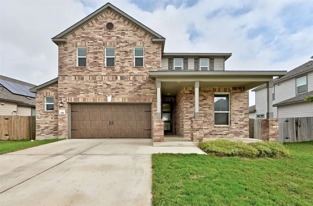 an outdoor space with furniture and garden