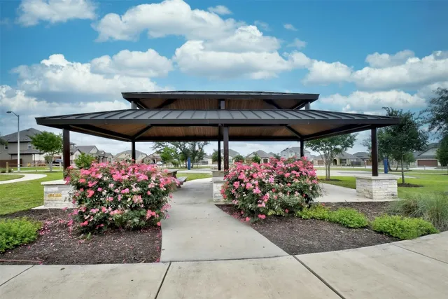 a view of outdoor space with playground and green space