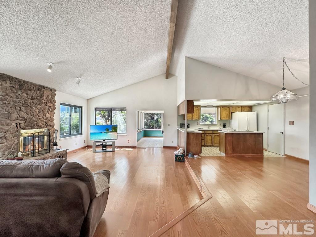 20595 Cooke Drive Reno, NV 89521 - Photo 11 of 32 a living room with furniture and a wooden floor