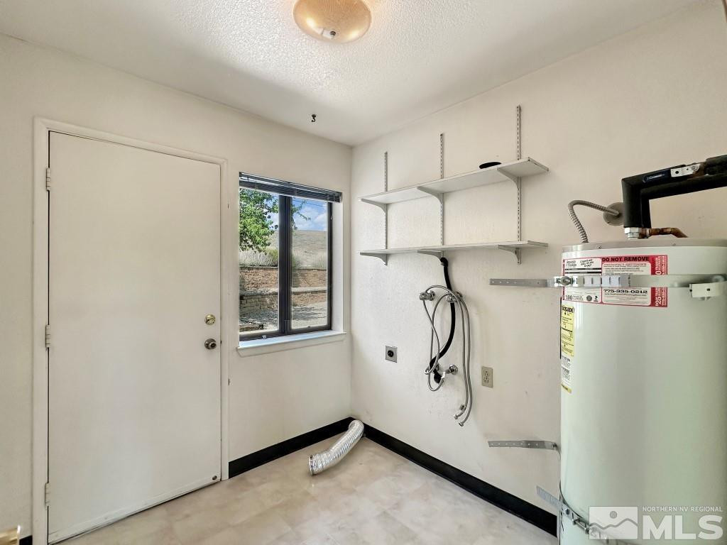 20595 Cooke Drive Reno, NV 89521 - Photo 24 of 32 a storage room with cabinets