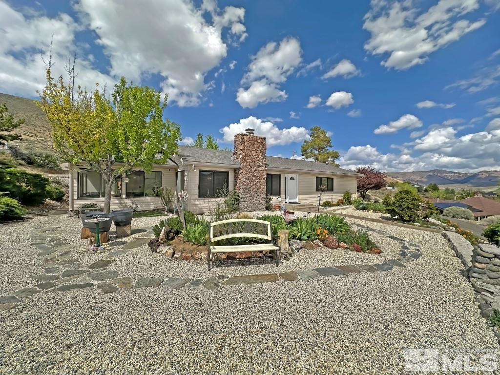 20595 Cooke Drive Reno, NV 89521 - Photo 3 of 32 a front view of a house with a yard