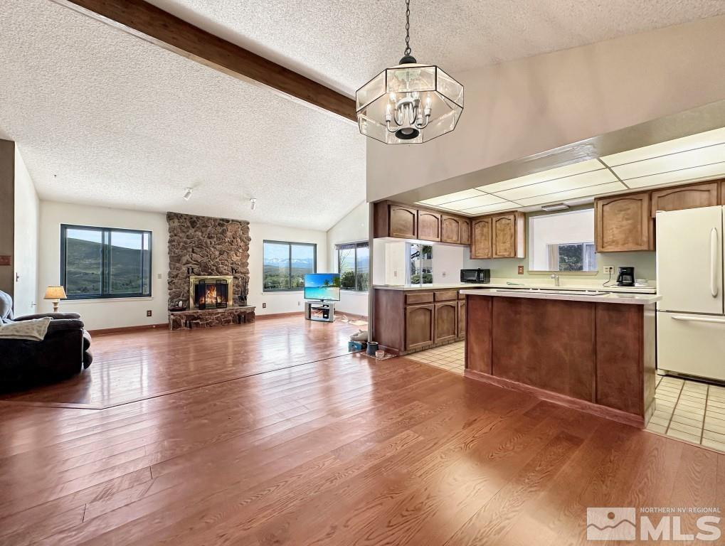 20595 Cooke Drive Reno, NV 89521 - Photo 7 of 32 a view of a living room and kitchen with a large window