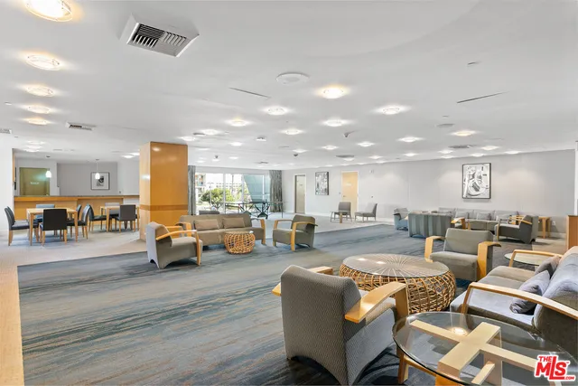 a media room with lots of chairs and a projector