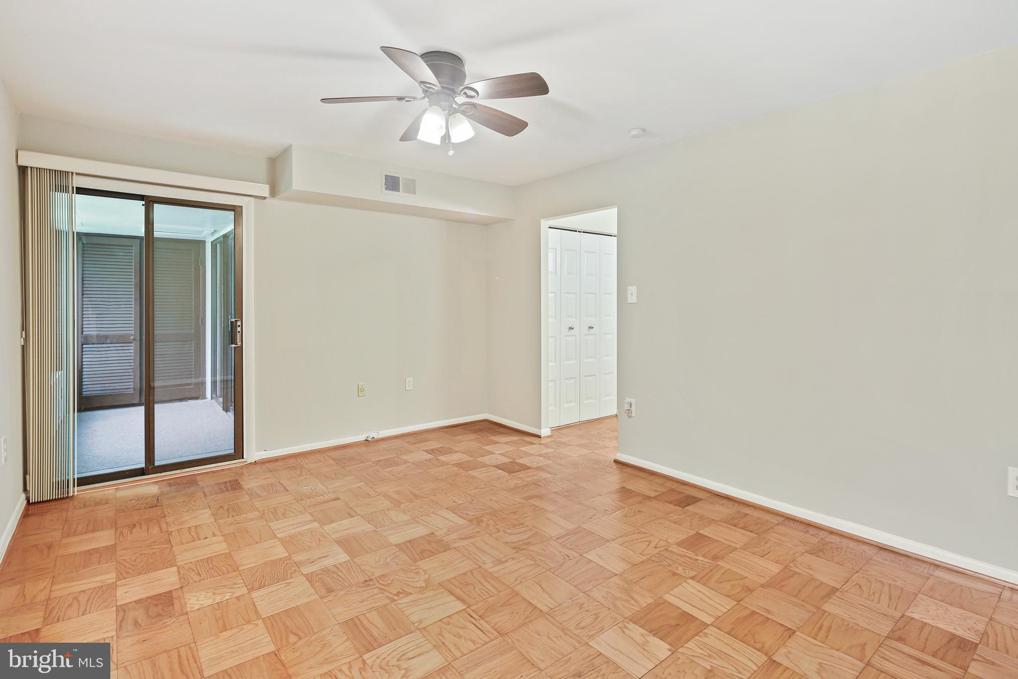 5239 West Running Brook Road, Unit 301 Columbia, MD 21044 - Photo 24 of 33 an empty room with fan and windows
