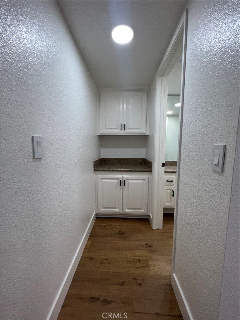 1731 East 68th Street Long Beach, CA 90805 - Photo 12 of 27 a kitchen with white cabinets and white appliances