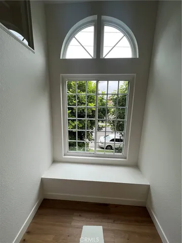 a bathroom with a bathtub and window