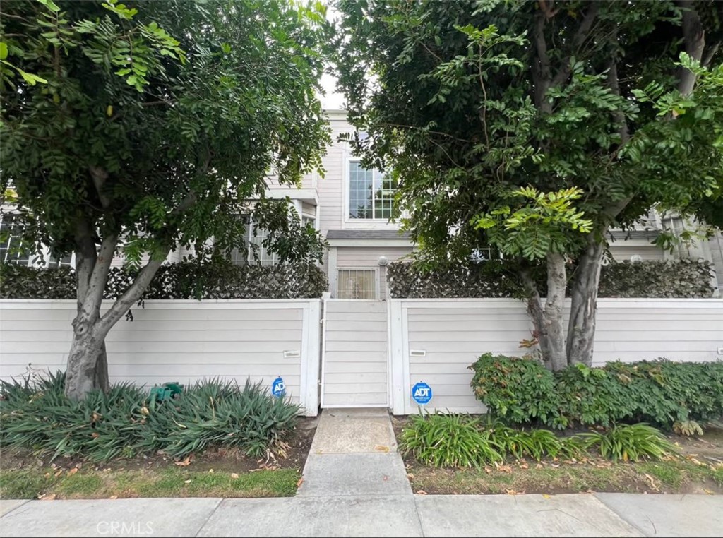 1731 East 68th Street Long Beach, CA 90805 - Photo 2 of 27 a front view of a house with garden