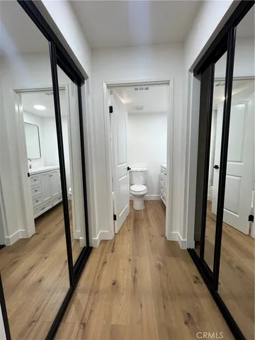 a view of a bathroom from a hallway