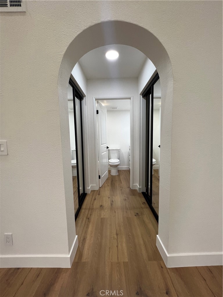 1731 East 68th Street Long Beach, CA 90805 - Photo 23 of 27 a view of a room with wooden floor and a bathroom