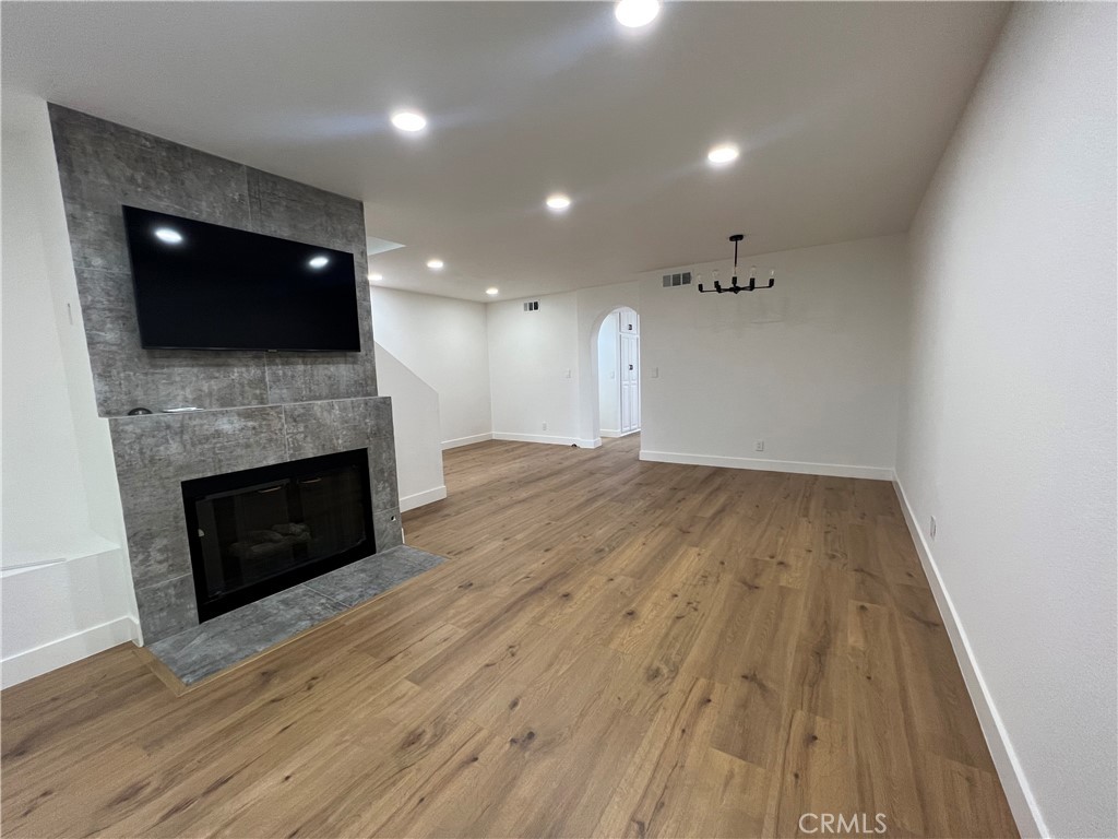 1731 East 68th Street Long Beach, CA 90805 - Photo 4 of 27 a view of a livingroom with an empty space and a fireplace