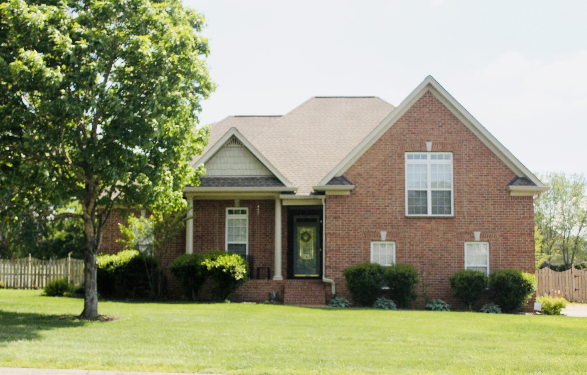 717 Heritage Road Lebanon, TN 37087 - Photo 1 of 30 a front view of a house with garden