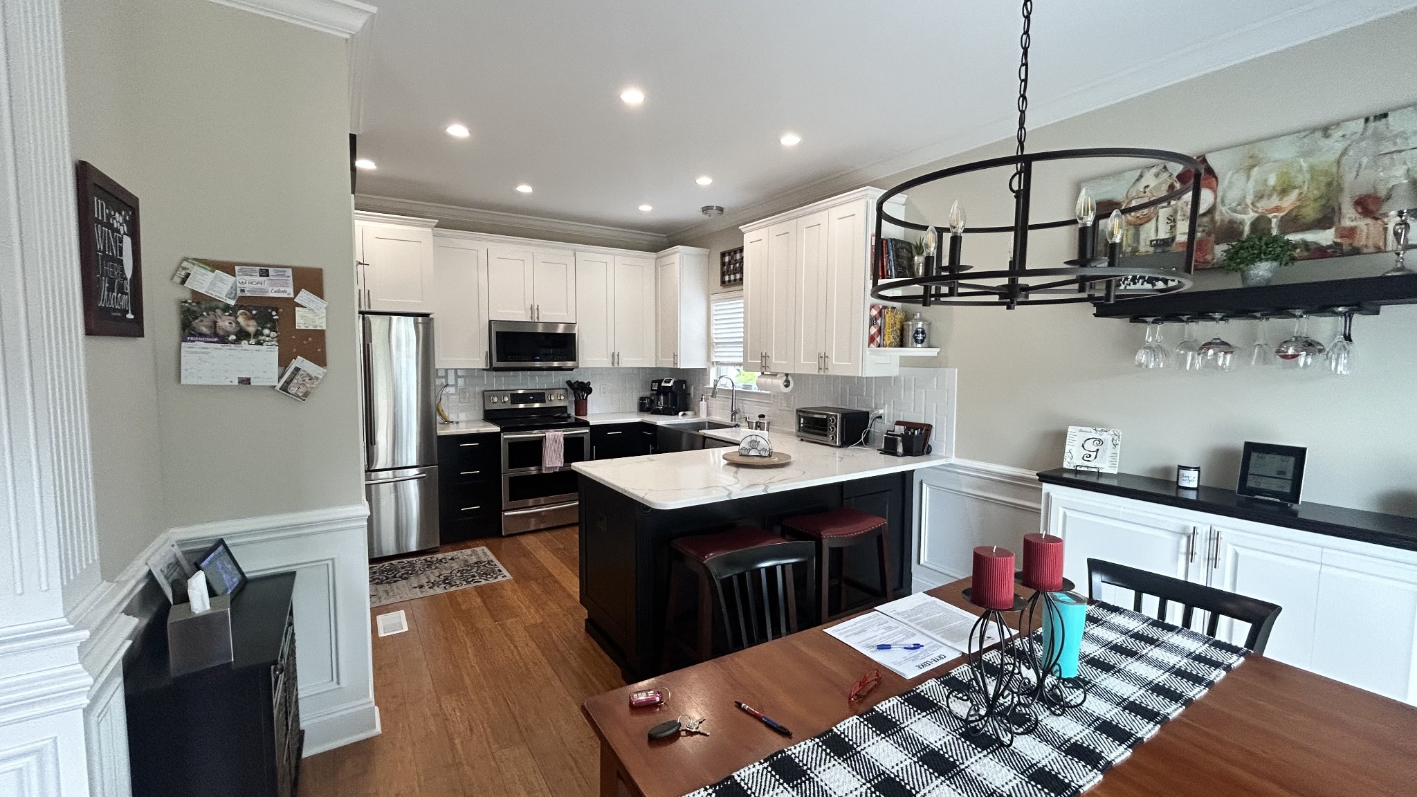 717 Heritage Road Lebanon, TN 37087 - Photo 11 of 30 a kitchen with stainless steel appliances granite countertop a sink dishwasher stove and refrigerator with wooden floor