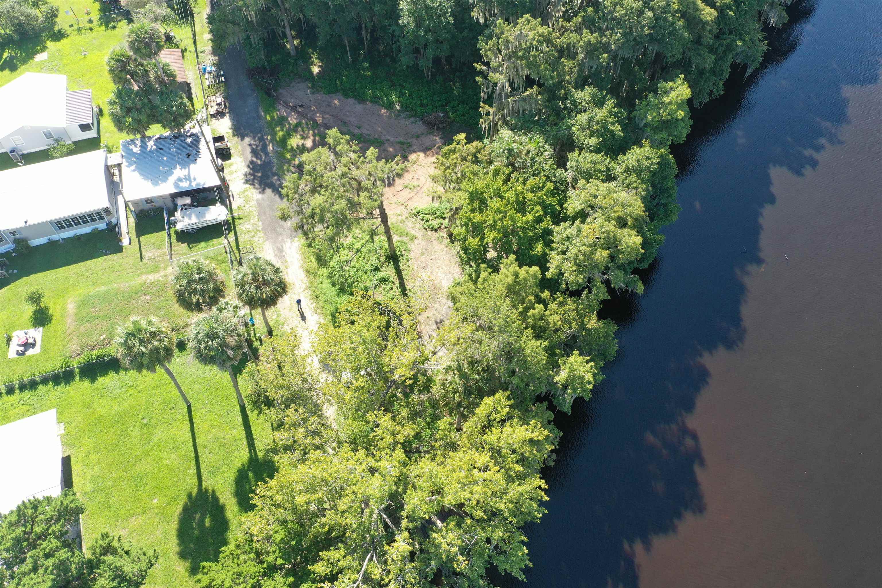 Wooten Rd Crescent Crescent City, FL 32112 - Photo 17 of 25 a view of yard with table and chairs and potted plants