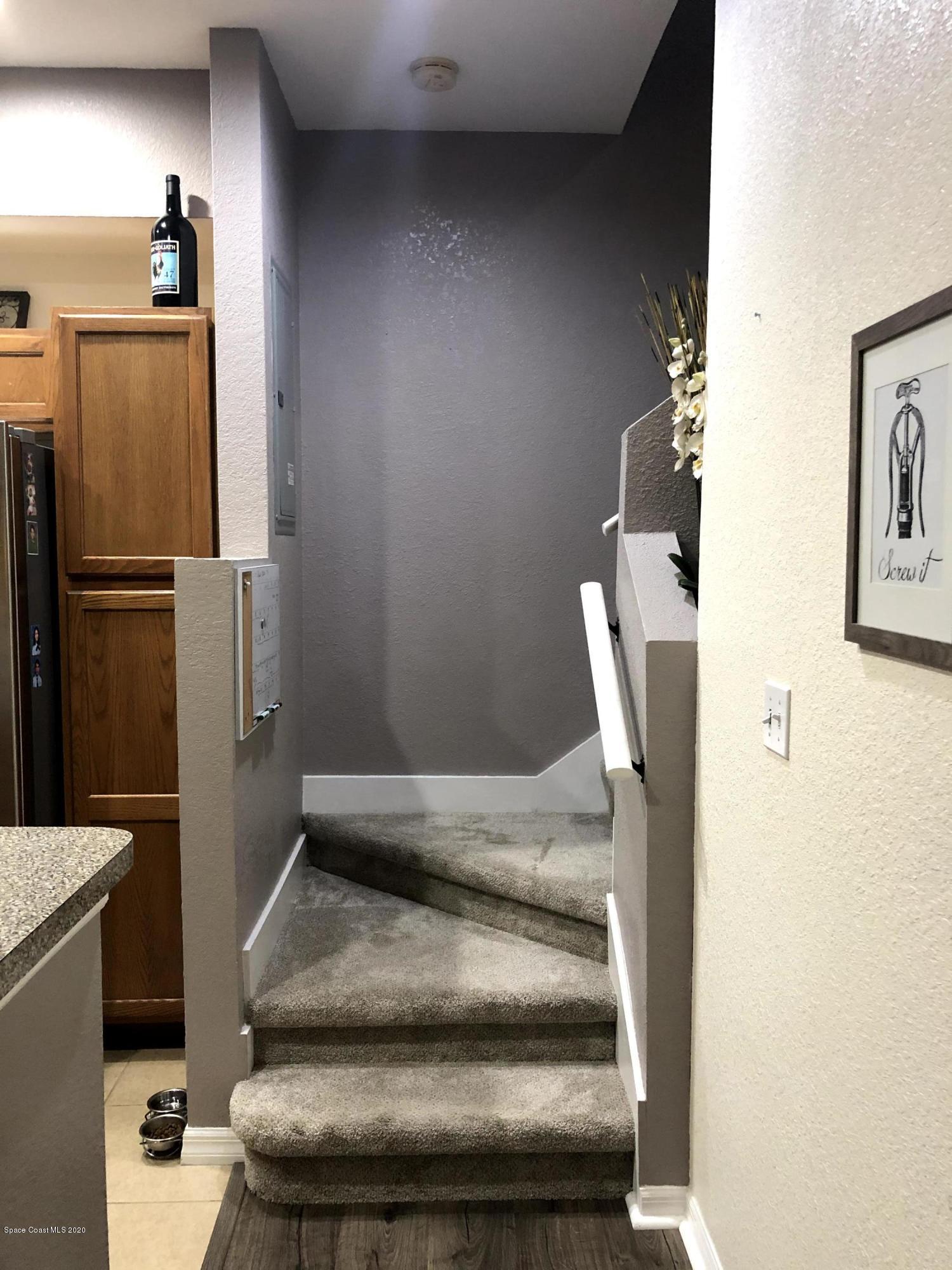 100 Turpial Way, Unit 107 Melbourne, FL 32901 - Photo 11 of 49 a bathroom with a sink and toilet