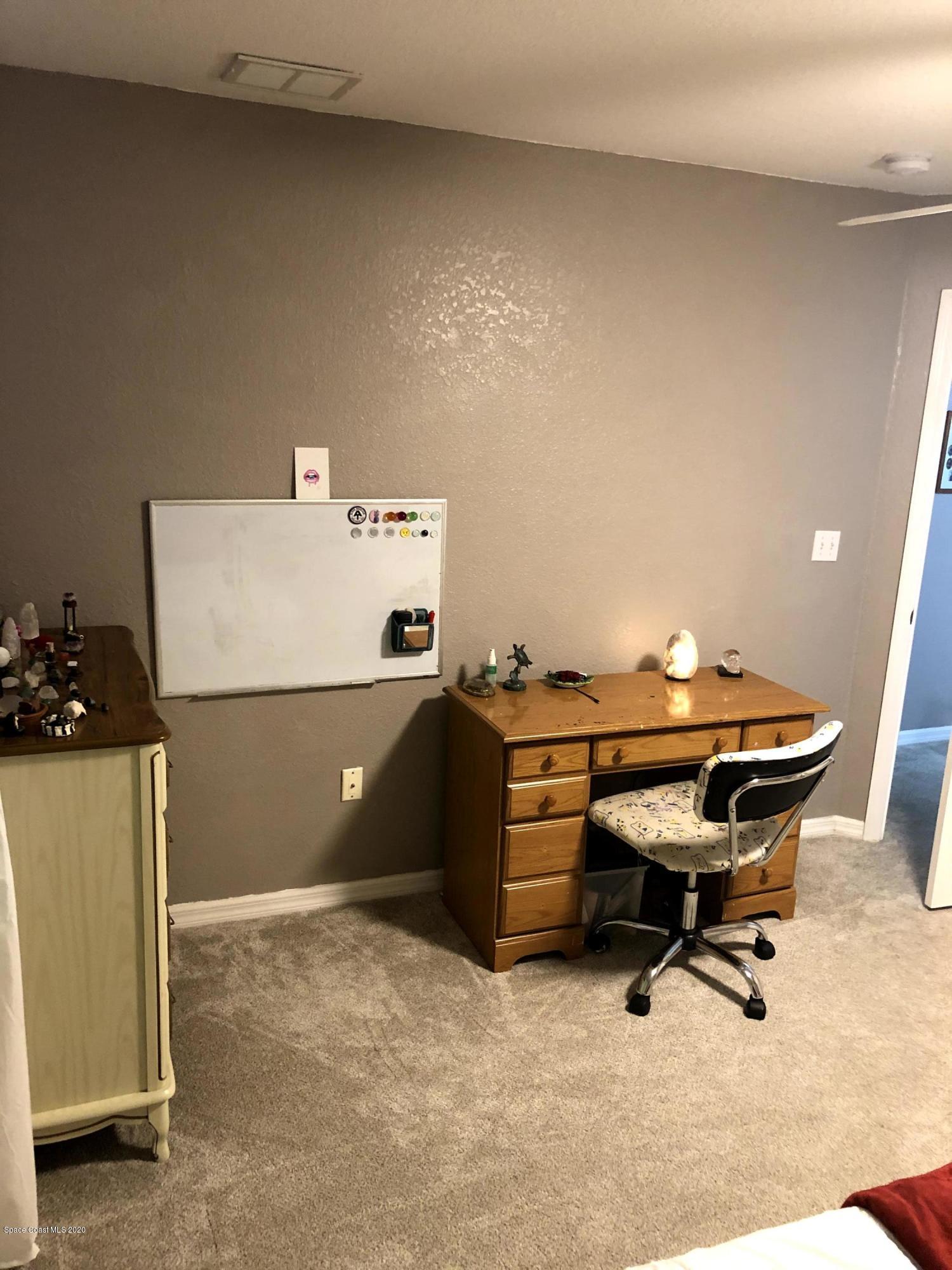 100 Turpial Way, Unit 107 Melbourne, FL 32901 - Photo 23 of 49 a living room with furniture