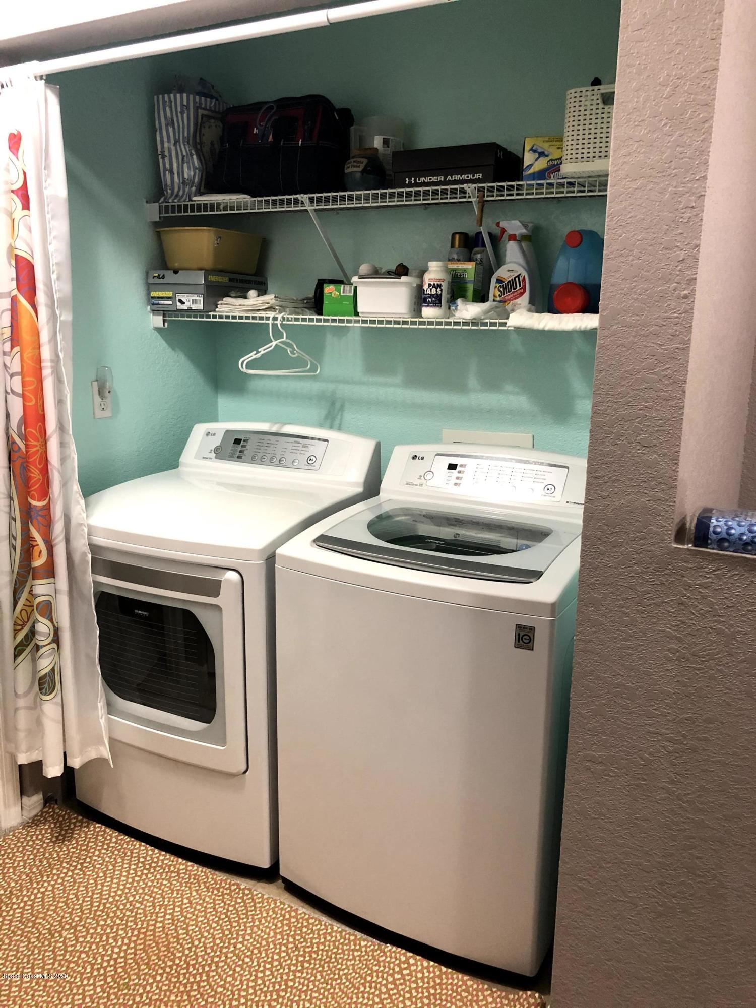 100 Turpial Way, Unit 107 Melbourne, FL 32901 - Photo 26 of 49 a utility room with dryer and washer