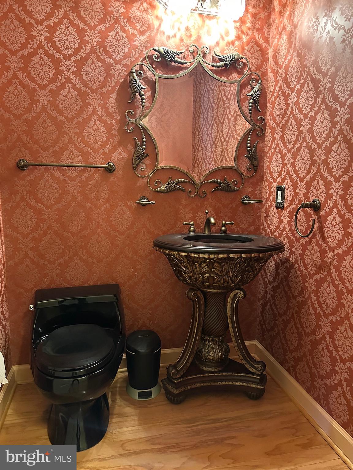 1830 Fountain Drive, Unit 607 Reston, VA 20190 - Photo 12 of 26 a bathroom with a toilet and a sink