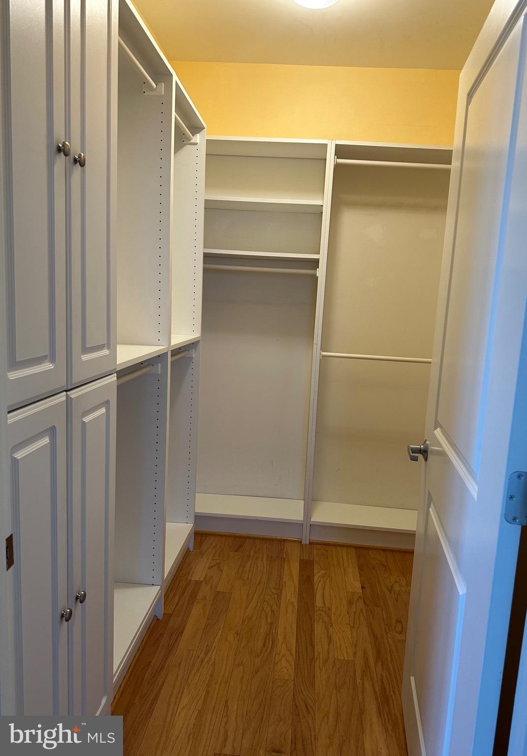1830 Fountain Drive, Unit 607 Reston, VA 20190 - Photo 16 of 26 a view of walk in closet with empty racks