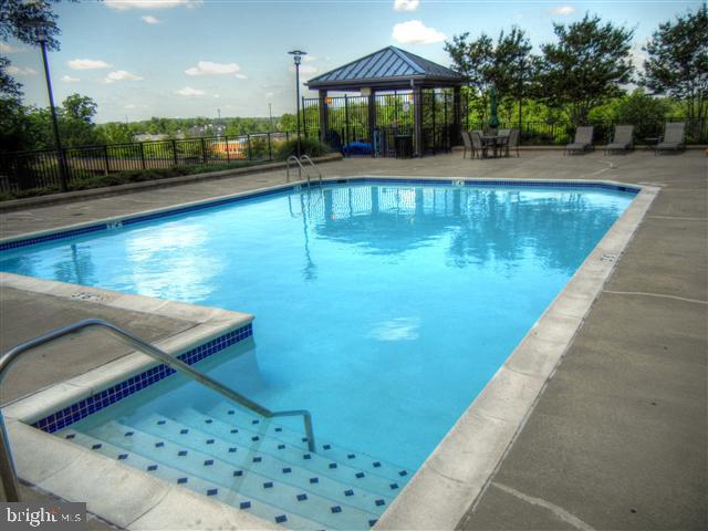 1830 Fountain Drive, Unit 607 Reston, VA 20190 - Photo 26 of 26 a view of a swimming pool with a patio