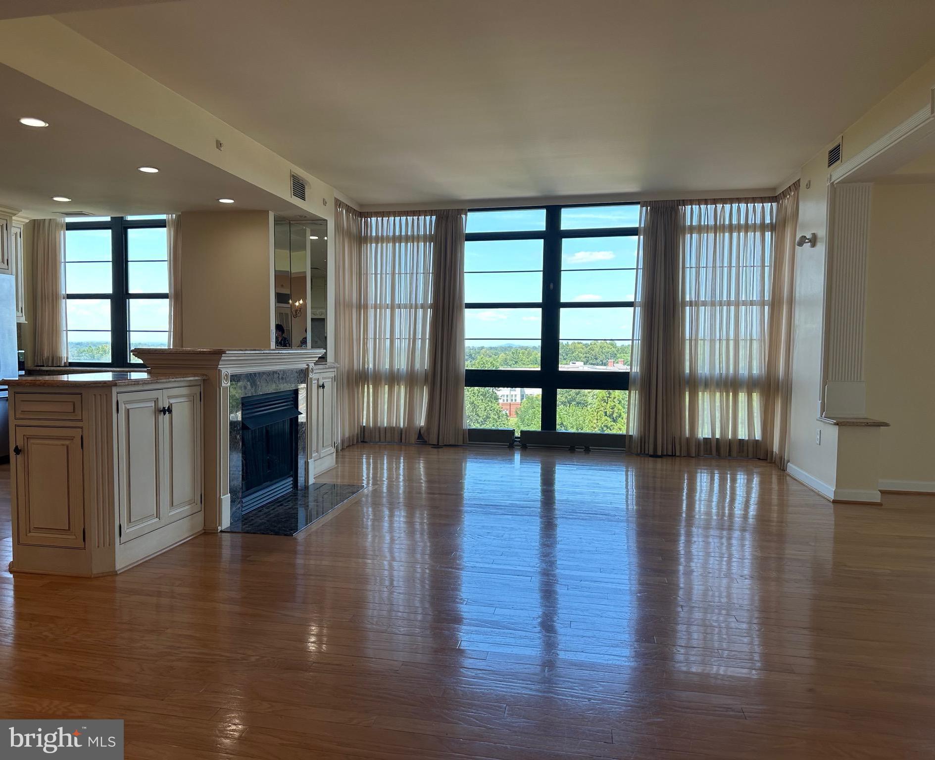 1830 Fountain Drive, Unit 607 Reston, VA 20190 - Photo 5 of 26 a view of a large kitchen with wooden floor and a window