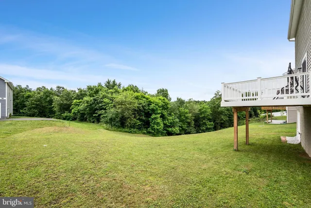 an aerial view of residential houses with outdoor space and swimming pool