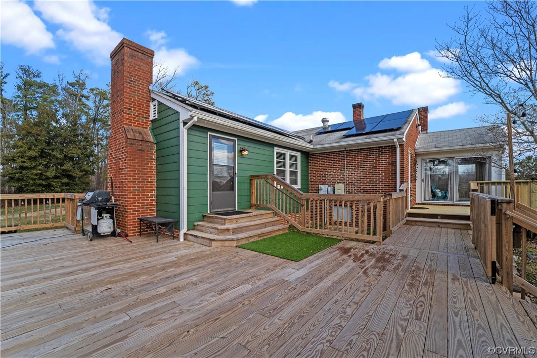 3600 Gregory Pond Road Chesterfield, VA 23236 - Photo 28 of 36 a view of a chairs and table on the wooden deck