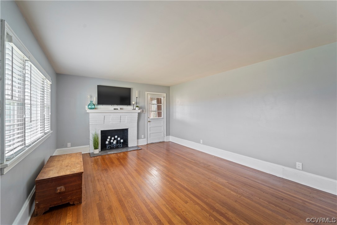 3600 Gregory Pond Road Chesterfield, VA 23236 - Photo 4 of 36 a view of empty room with fireplace and wooden floor