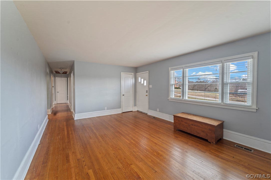 3600 Gregory Pond Road Chesterfield, VA 23236 - Photo 5 of 36 a view of empty room with wooden floor and fan