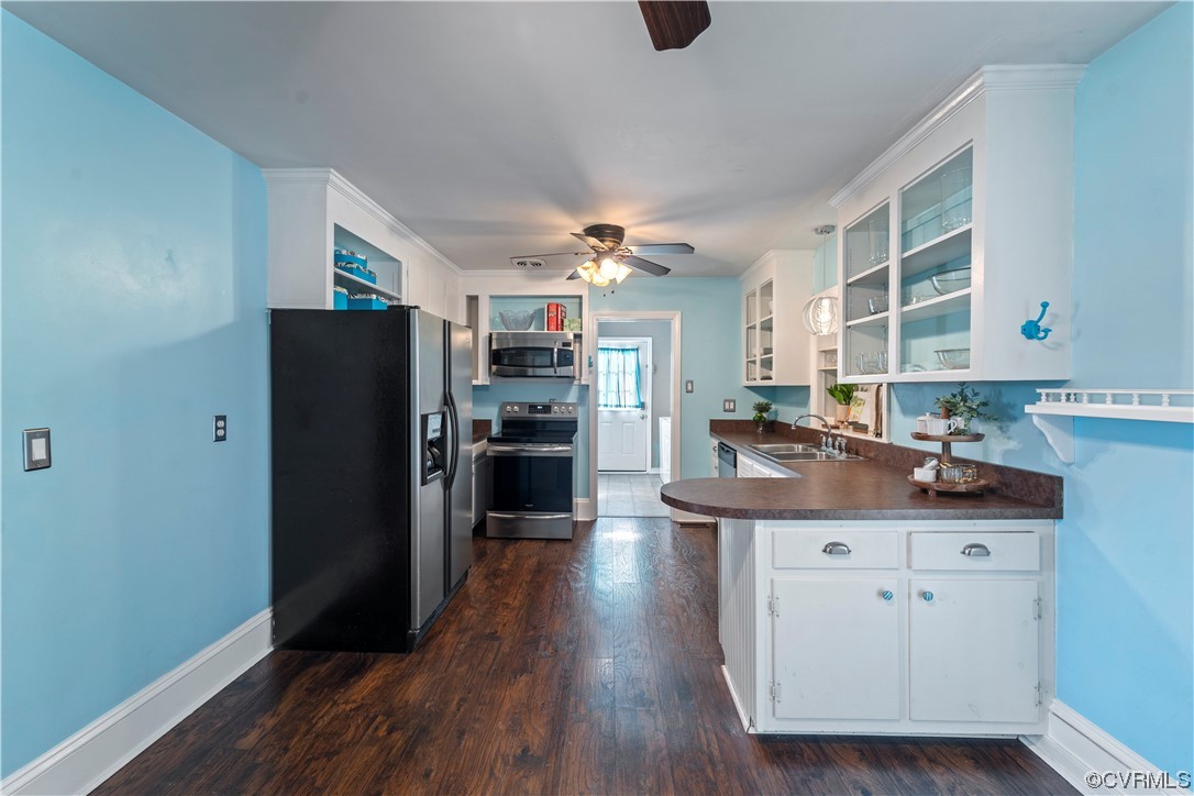 3600 Gregory Pond Road Chesterfield, VA 23236 - Photo 8 of 36 a kitchen with stainless steel appliances kitchen island granite countertop a refrigerator a sink a stove and white cabinets with wooden floor