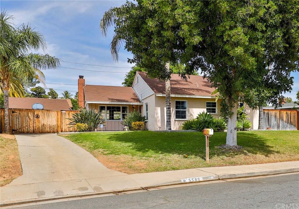 5585 Fargo Road Riverside, CA 92506 - Photo 1 of 1 a front view of a house with a yard and garage