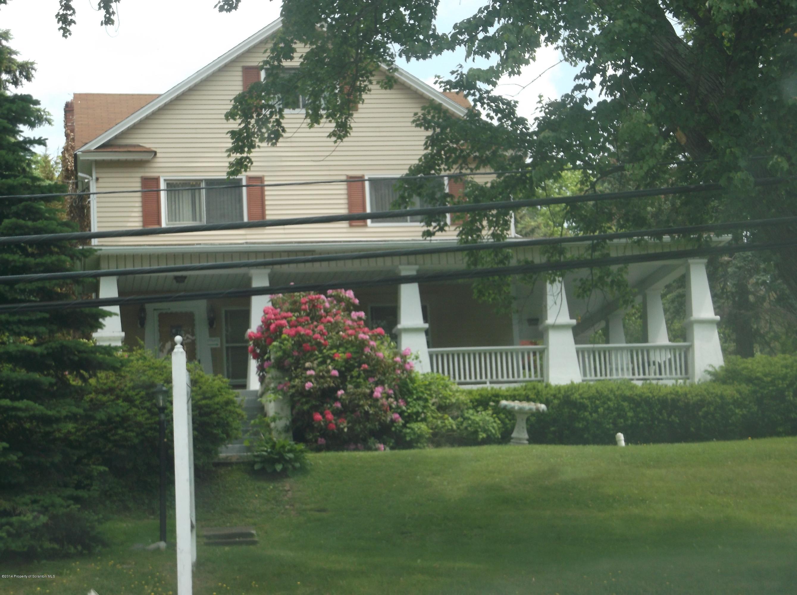 406 North State Street Clarks Summit, PA 18411 - Photo 3 of 6 a front view of a house with a garden