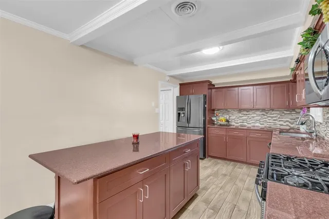 a kitchen with stainless steel appliances granite countertop a sink and cabinets