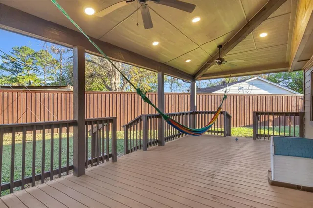 a view of a balcony with wooden floor