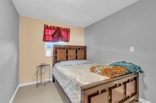 a bedroom with a bed and a table