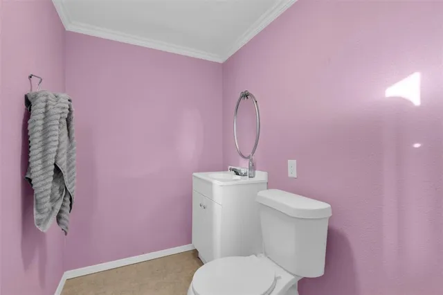 a bathroom with a toilet and sink