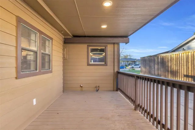 a view of a hall with wooden floor