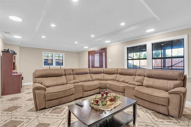 a living room with furniture and a large window