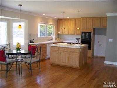 746 McClay Road Novato, CA 94947 - Photo 8 of 12 a kitchen with a table chairs stove and refrigerator