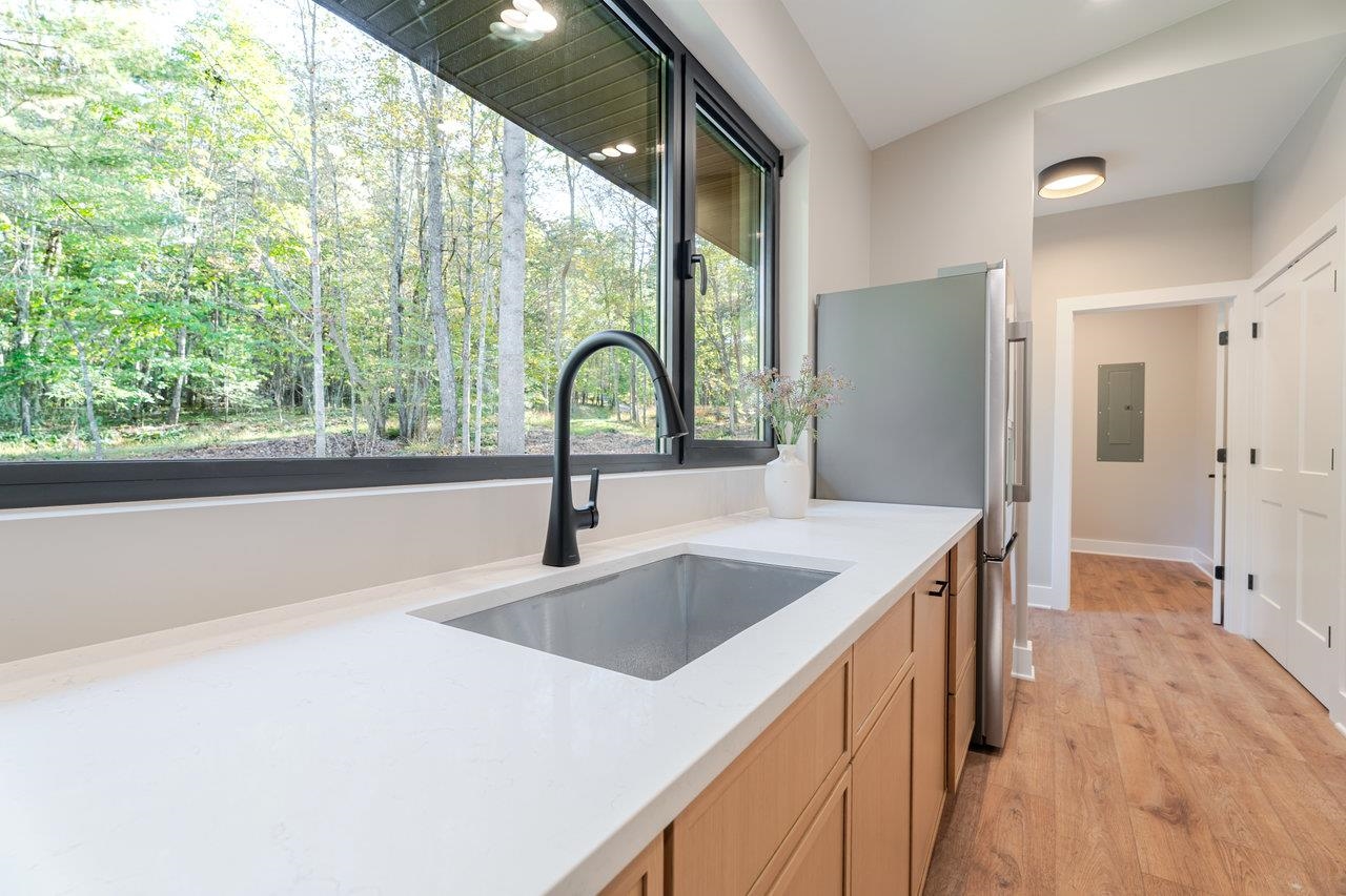 209 Beaver Road Basye, VA 22842 - Photo 14 of 68 a kitchen with a sink a counter top space and stainless steel appliances