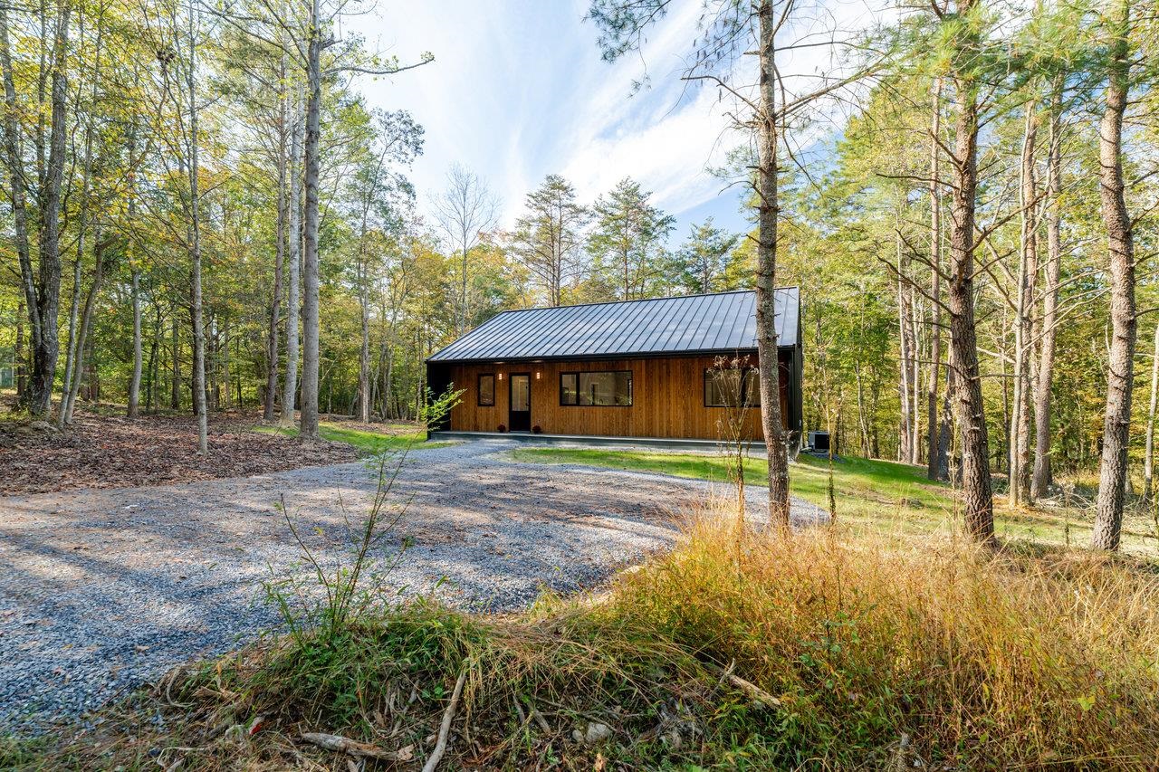 209 Beaver Road Basye, VA 22842 - Photo 2 of 68 a view of a house with backyard and trees