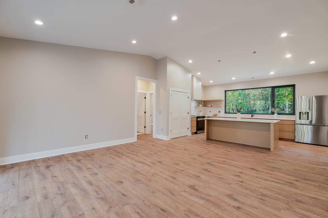 209 Beaver Road Basye, VA 22842 - Photo 21 of 68 a large kitchen with stainless steel appliances granite countertop a large counter top and a wooden floor