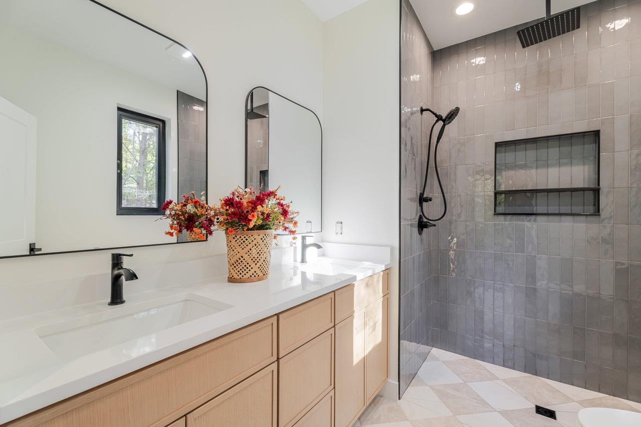 209 Beaver Road Basye, VA 22842 - Photo 26 of 68 a bathroom with a granite countertop sink a mirror and shower