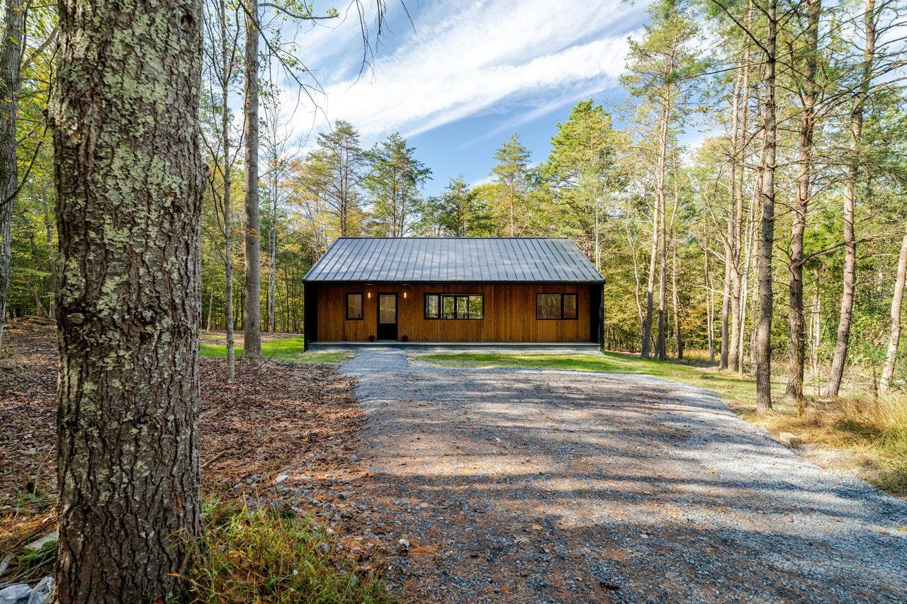 209 Beaver Road Basye, VA 22842 - Photo 41 of 68 a front view of a house with a garden