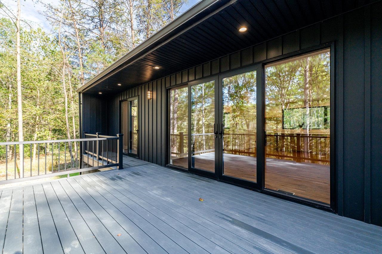 209 Beaver Road Basye, VA 22842 - Photo 55 of 68 a view of empty room with wooden floor and floor to ceiling window