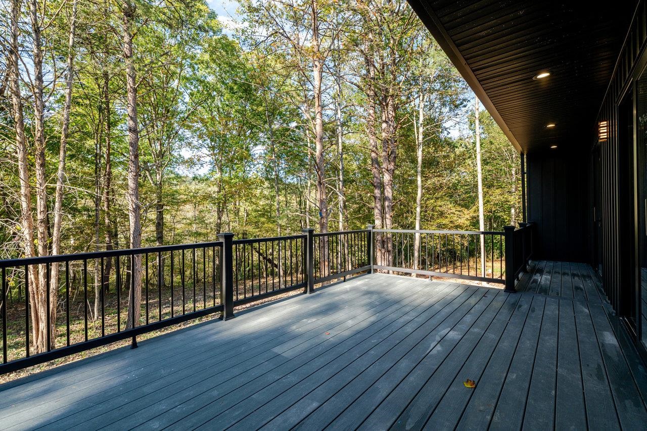 209 Beaver Road Basye, VA 22842 - Photo 57 of 68 a view of a room with wooden floor and iron stairs