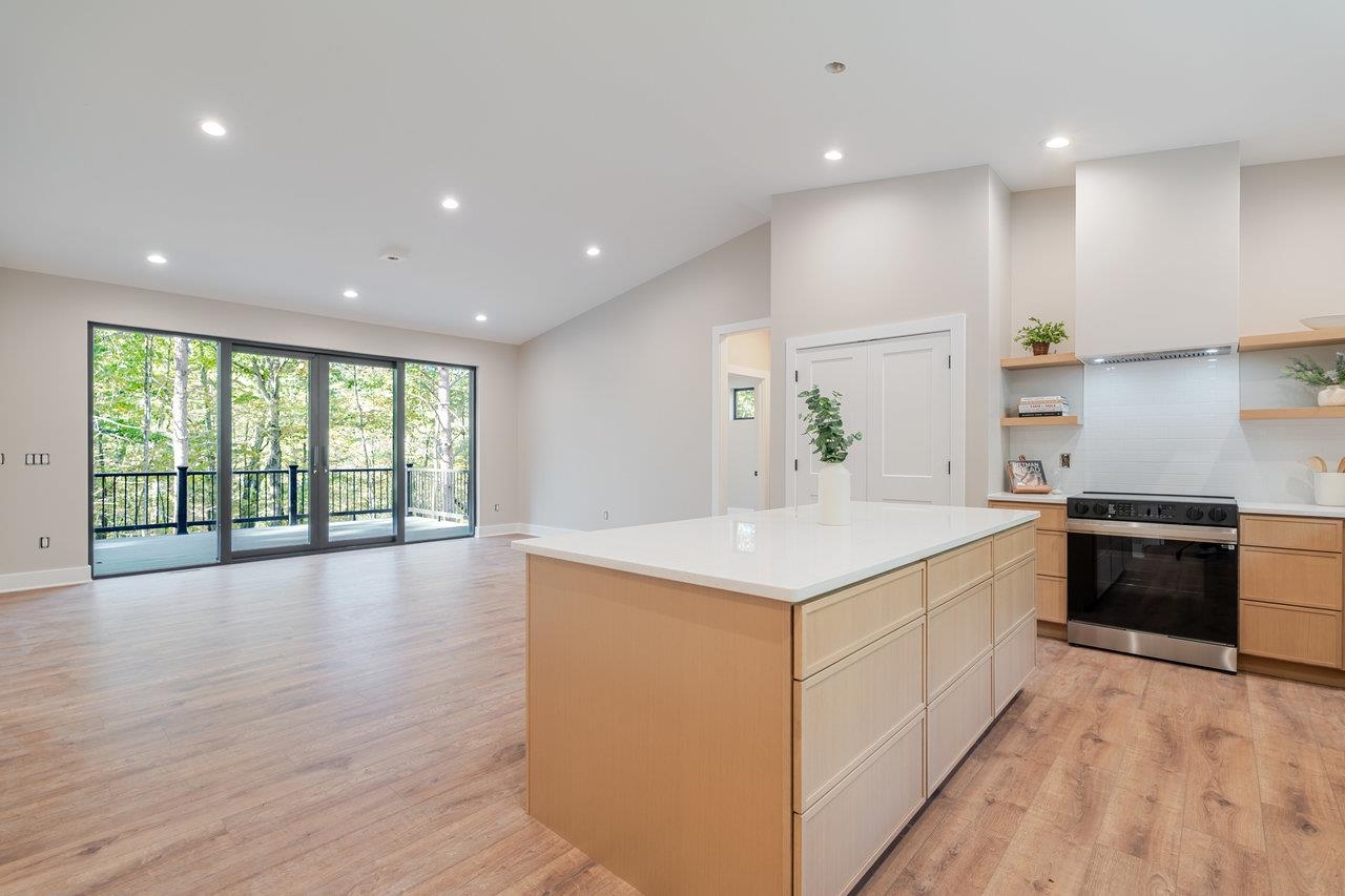 209 Beaver Road Basye, VA 22842 - Photo 6 of 68 a large kitchen with stainless steel appliances granite countertop a large counter top and a wooden floors