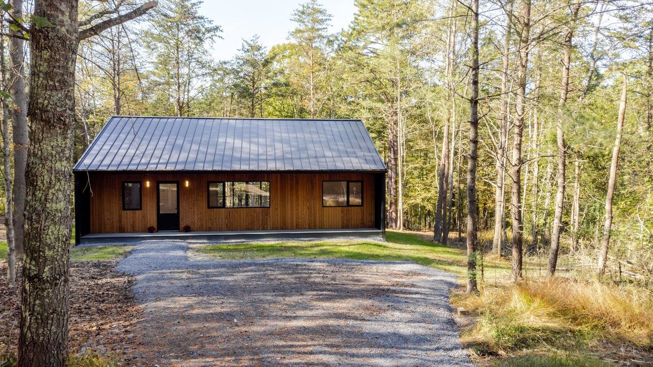 209 Beaver Road Basye, VA 22842 - Photo 61 of 68 a front view of a house with a yard and trees