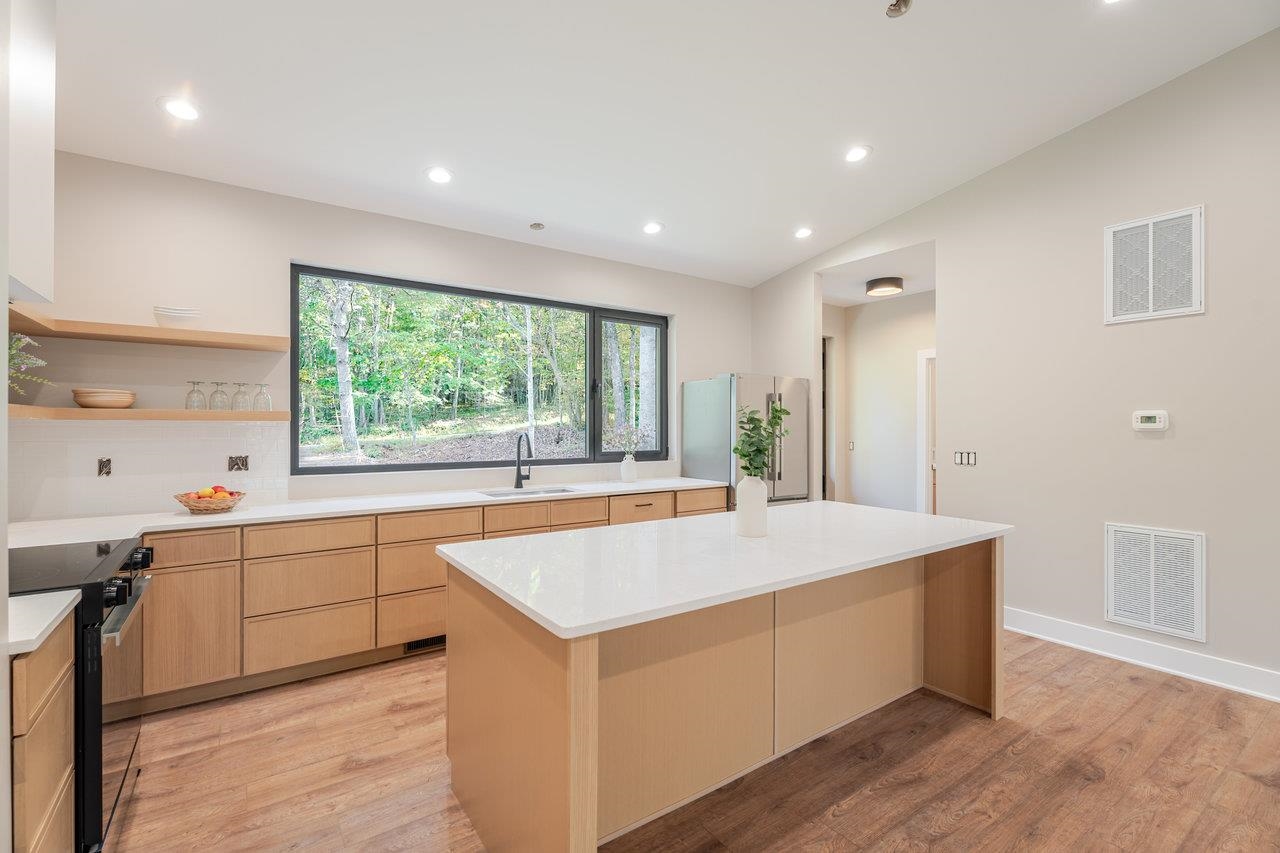 209 Beaver Road Basye, VA 22842 - Photo 8 of 68 a large kitchen with kitchen island a sink window and wooden floor