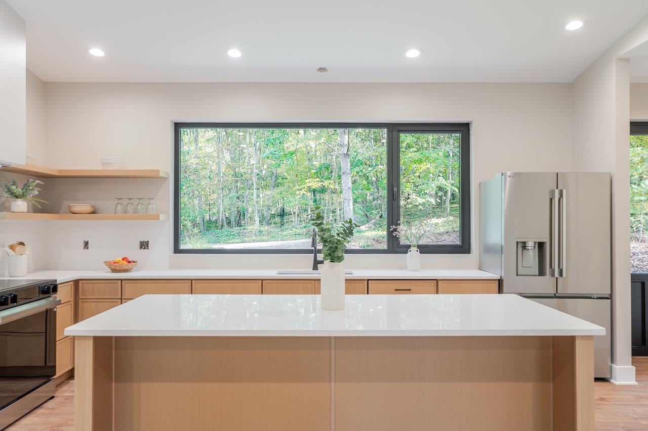 209 Beaver Road Basye, VA 22842 - Photo 10 of 68 a kitchen with a window a sink and a counter top space