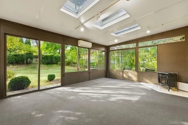 a view of livingroom with furniture and a window